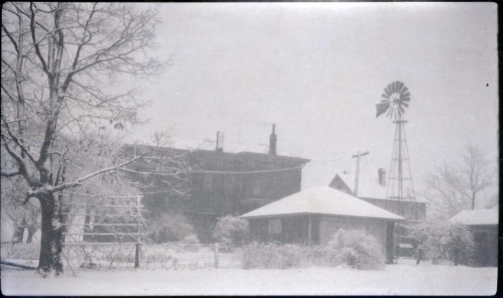 Barn and windmill in winter