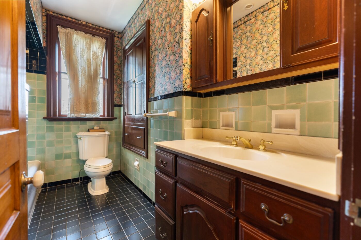 Green tiled bath, the vanity